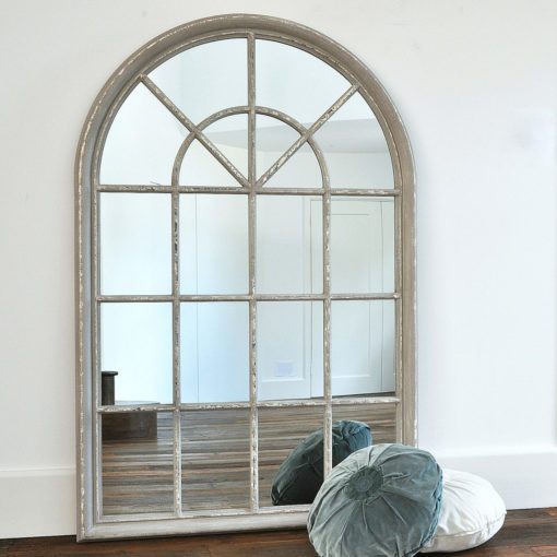 large wooden arched window mirror with a distressed grey painted finish