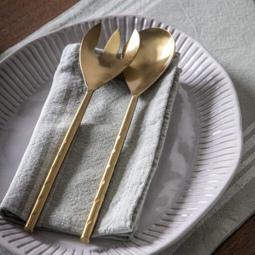 pair of stainless steel salad servers with a matt gold finish