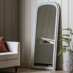 full length wooden mirror with a stone grey painted finish, arched top and beaded detailing