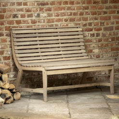 acacia wood slatted garden bench with curved seat and natural finish