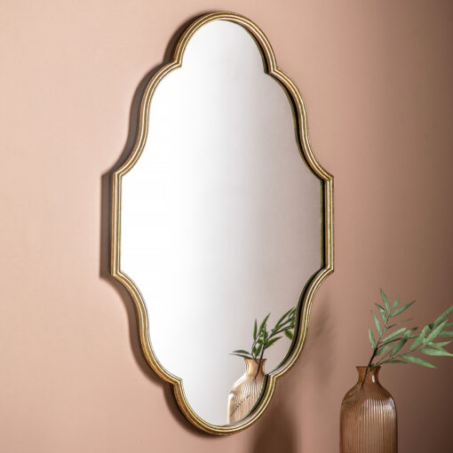 decorative gold metal framed wall mirror with elegant curved edging