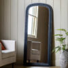 full length wooden mirror with a black painted finish, arched top and beaded detailing