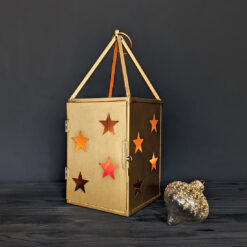 rustic metal square lantern with cut-out stars on each side finished in a matt gold