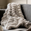 luxuriously soft natural chunky ribbed faux fur throw with plain reverse