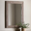 decorative rectangle wall mirror with a stepped ribbed wide frame and antique gold finish