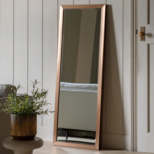 rectangular full length leaner mirror with a tightly ribbed industrial style bronzed