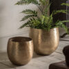 set of two large gold metal planters with a hammered finish