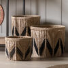 set of three natural round storage baskets handcrafted from rope with a contrasting black zig zag design