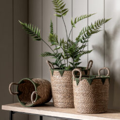 set of three round natural seagrass baskets with handles and olive green rope detailing