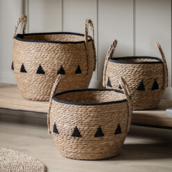 set of three round natural seagrass baskets with handles and black rope detailing