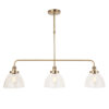 industrial style antique brass linear light with three glass domed hanging pendants