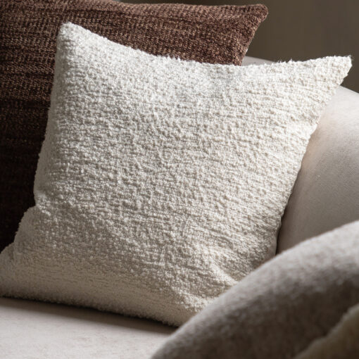 50cm x 50cm square cream cushion with a textured woven boucle front and plain reverse