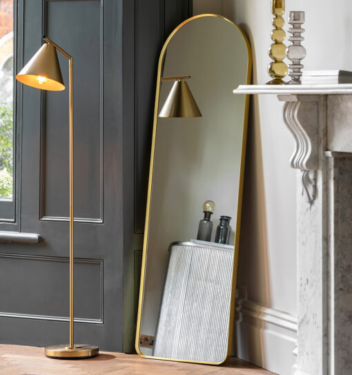 slim arched full-length wall mirror with a slim metal frame and warm gold finish