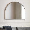 large arched overmantle wall mirror with a slim metal frame finished in matt black