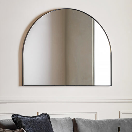 large arched overmantle wall mirror with a slim metal frame finished in matt black