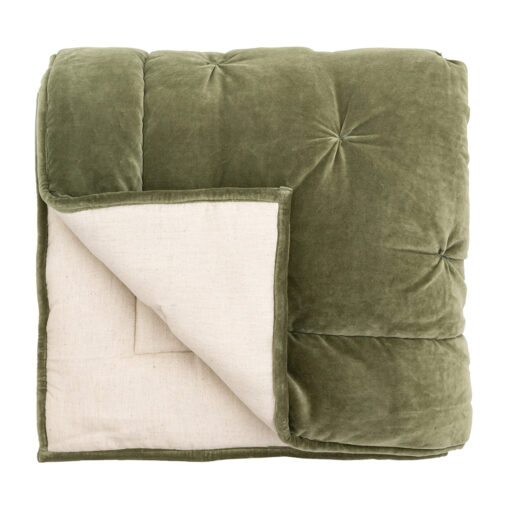 luxurious green velvet bedspread with a quilted design and natural cotton and linen blend reverse